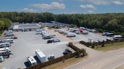 parking lot with RVs and boats